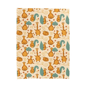 Giraffes leaning their necks together on the DipaliZ plush blanket design
