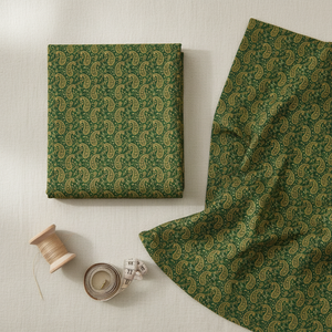 Green paisley fabric flatlay