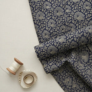 Flat lay of DipaliZ peacock paisley combed cotton fabric by the yard