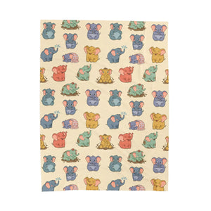 Powder blue and blush elephant shapes on the DipaliZ nursery blanket