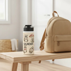 Woodland raccoons printed in a band around a DipaliZ insulated bottle