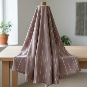 DipaliZ striped rose cotton fabric wrapped on a bolt for cutting by the yard