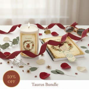 Taurus Bundle with candle, notebook, and ribbons on a white surface